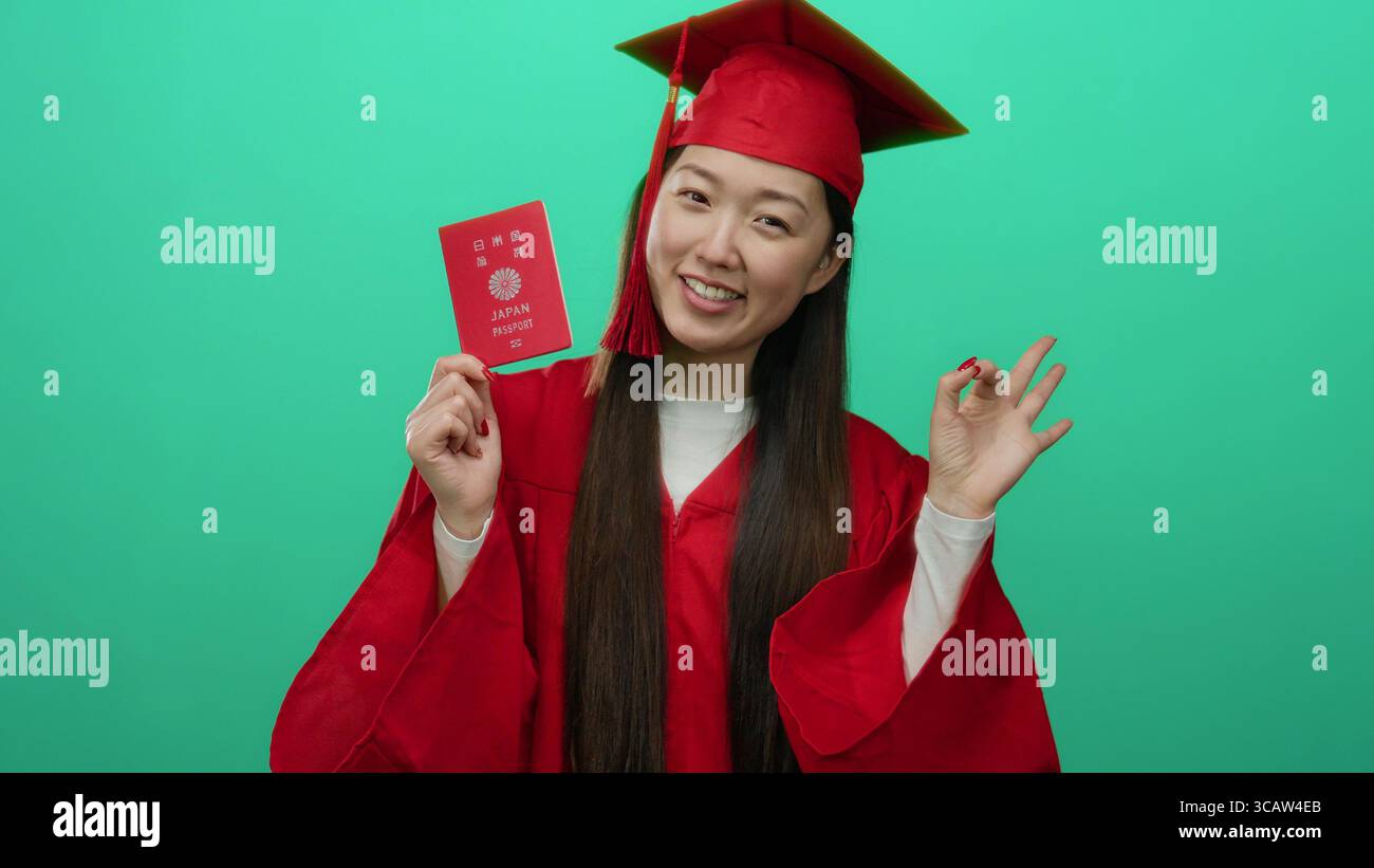 Japan Graduation Robe Japanese woman in red graduation gown proudly displays japan passport ...