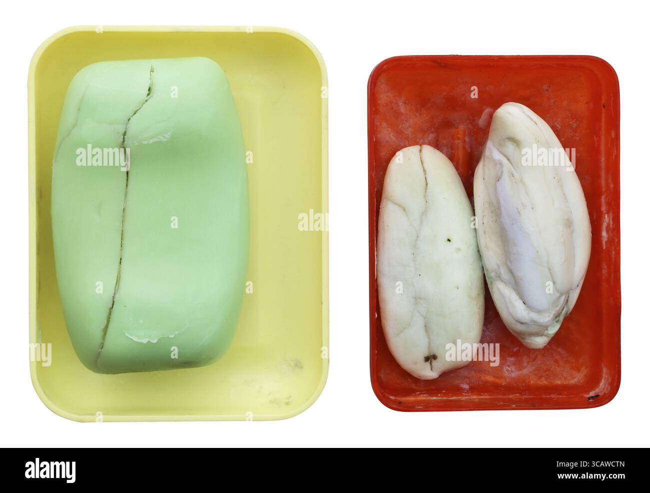 Old rustic dry cracked soap in plastic broken dishes. Isolated with patch Stock Photo