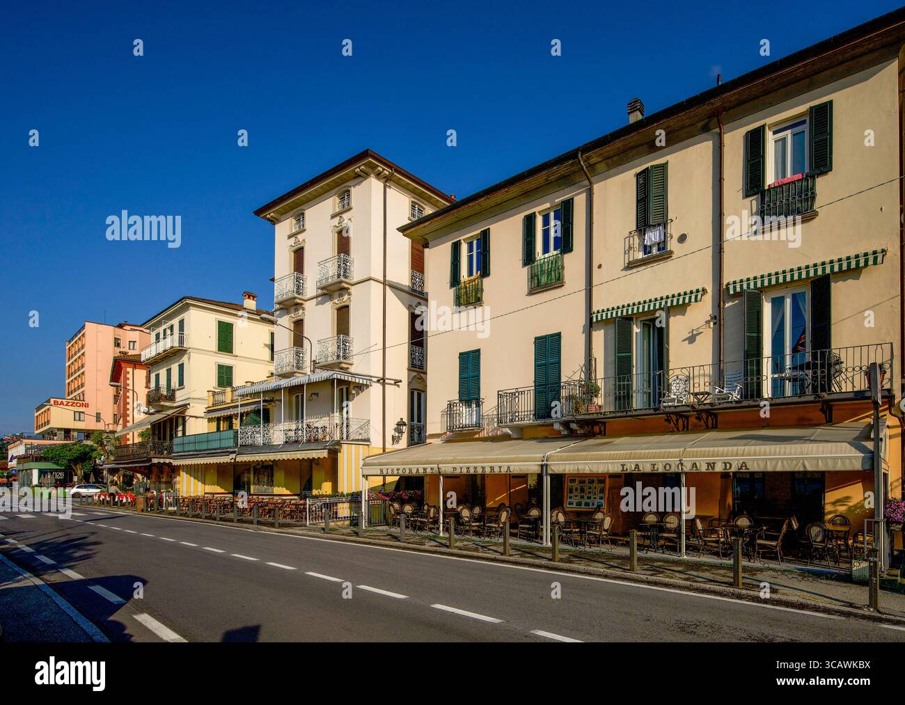 Restaurants and cafes on the lakeside road of Tremezzo, with the ...