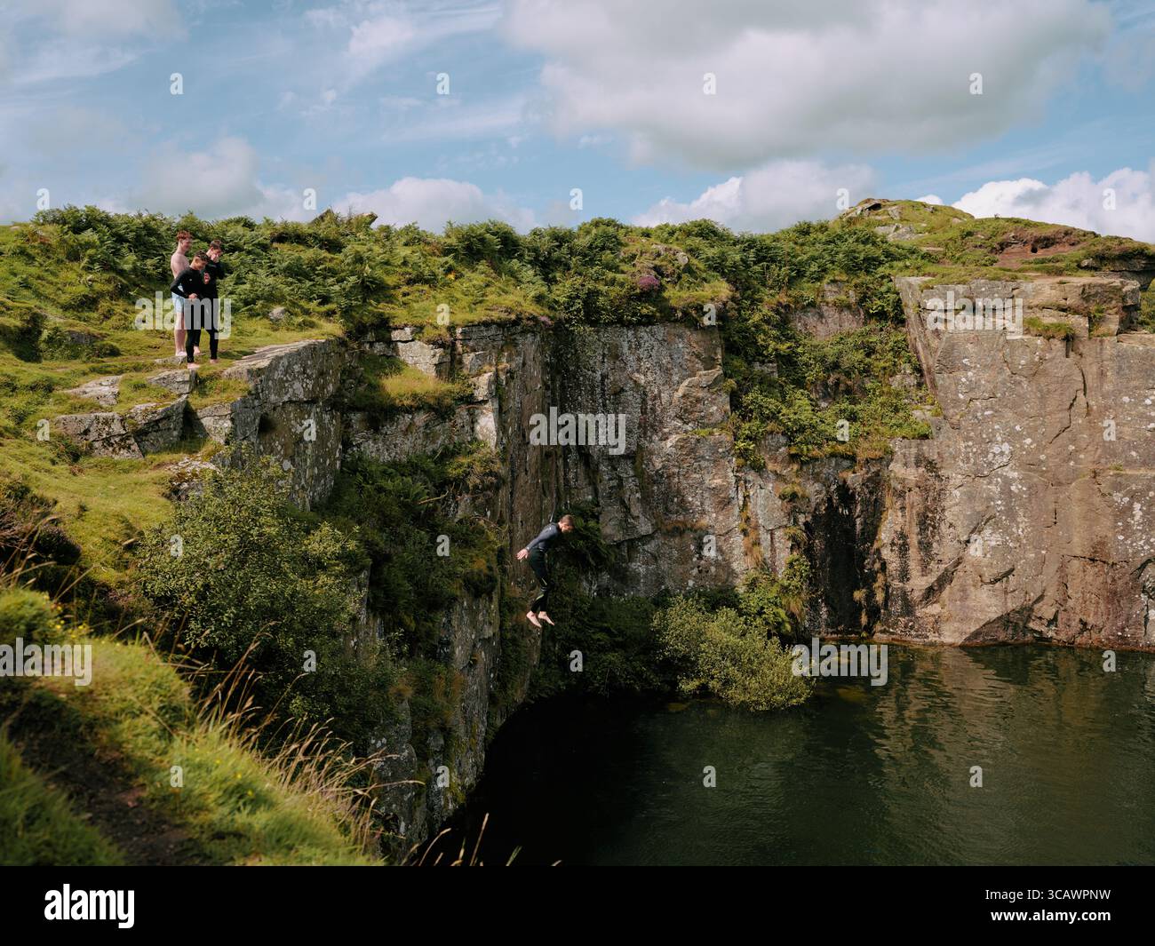 Swimmers at Gold Diggings Quarry, Minions, Bodmin Moor, Cornwall England UK Stock Photo
