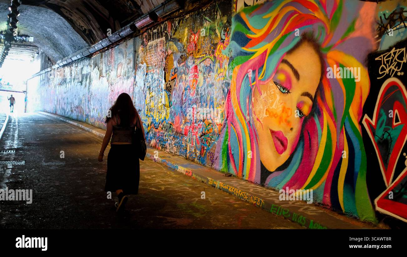 Walking past part of the Graffiti Tunnel in Leake Street, Central London, in the summer of 2025. Stock Photo