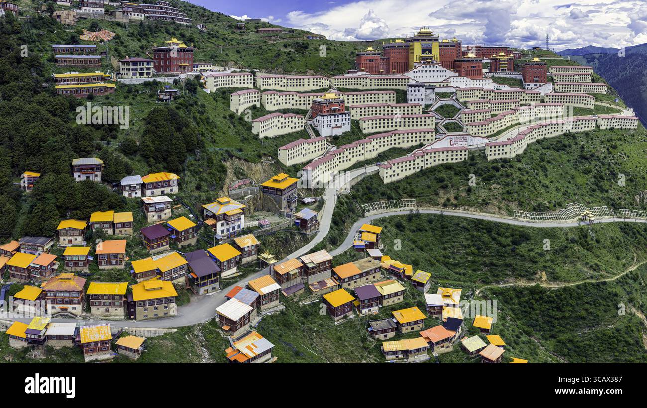 Aerial view of Gatuo Monastery's vibrant rooftops cascade down the ...