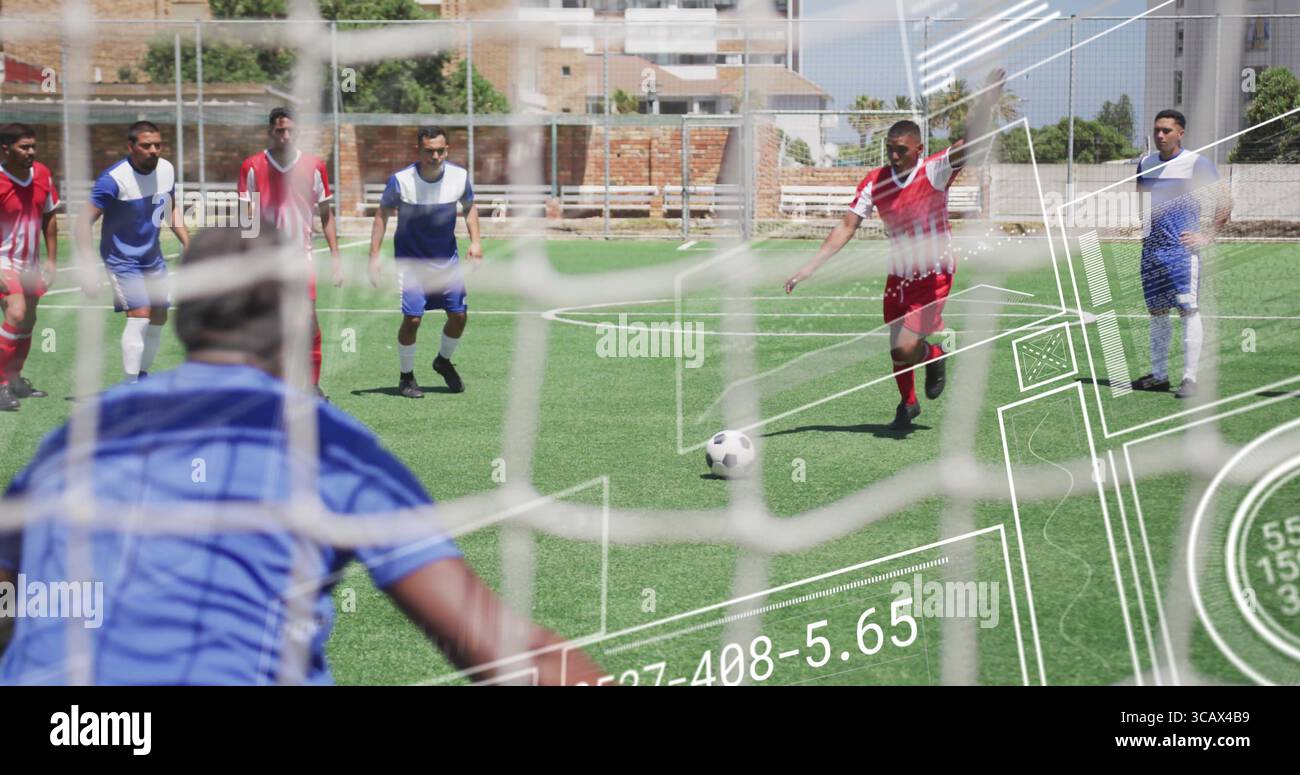 Aiming red-jerseyed striker preparing free-kick at urban soccer field, with soccer ball and netting Stock Photo