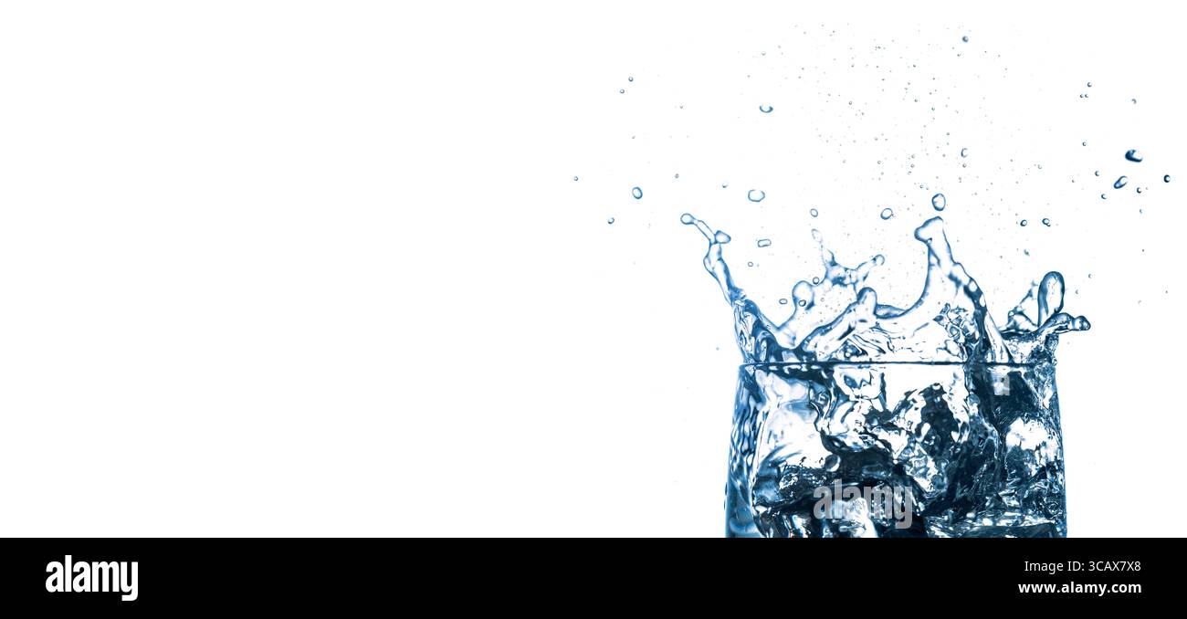 Water splashes. Falling ice cubes into glass isolated on white ...