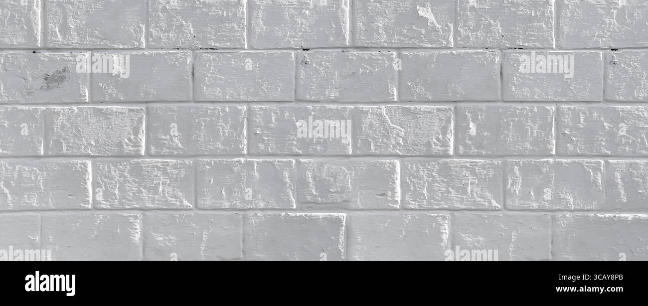 White painted brick wall providing a textured and seamless backdrop Stock Photo