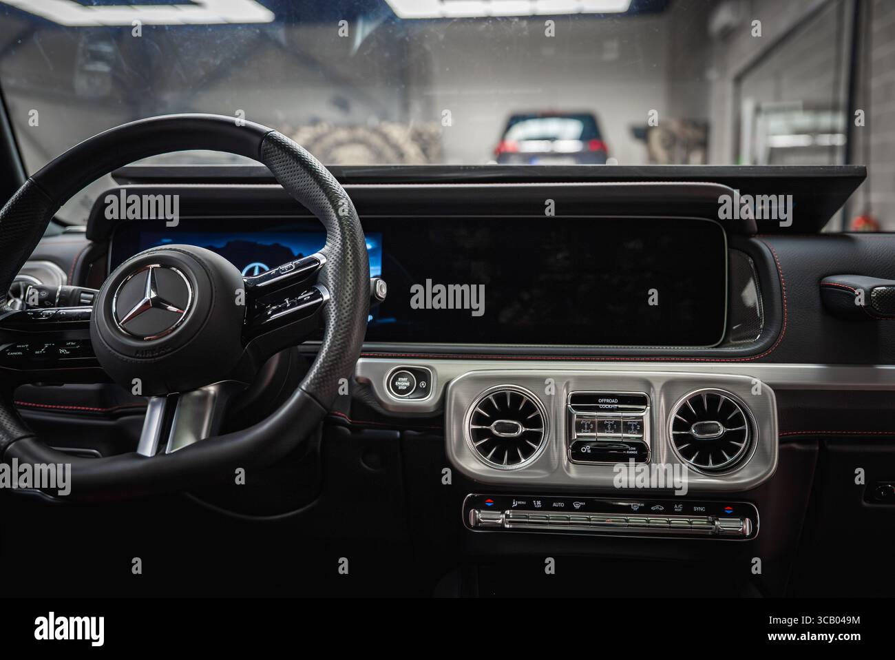 Interior of a Mercedes G Class with Focus on Dashboard and Steering Wheel Stock Photo