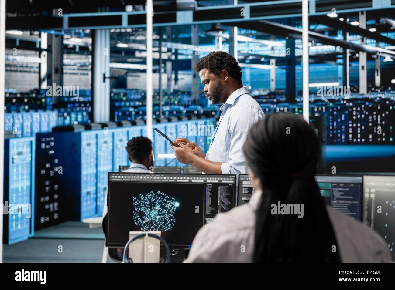 Data center system administrator deploys AI visualization tool to forecast infrastructure demands and optimize resource allocation. Server hub IT expert uses artificial intelligence for maintenance Stock Photo