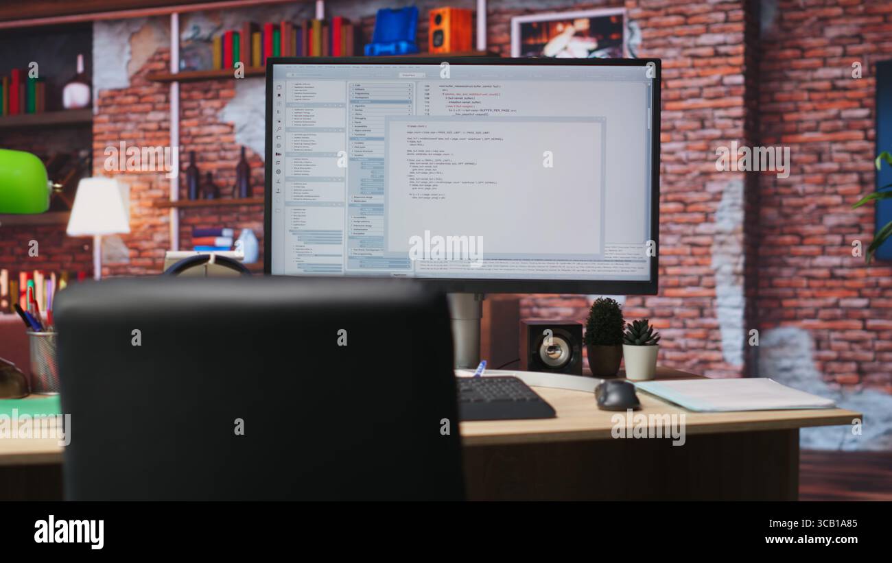 Lines of code written on PC workstation screen on development tool application. Debugging software programming language displayed on computer monitor in living room office Stock Photo