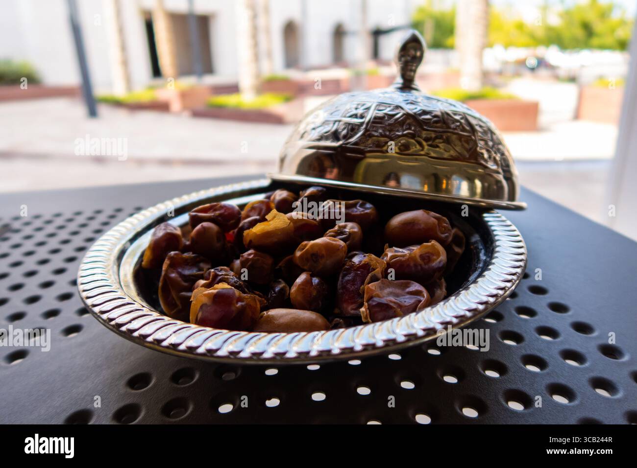 Omani dried dates on a silver tray. Stock Photo