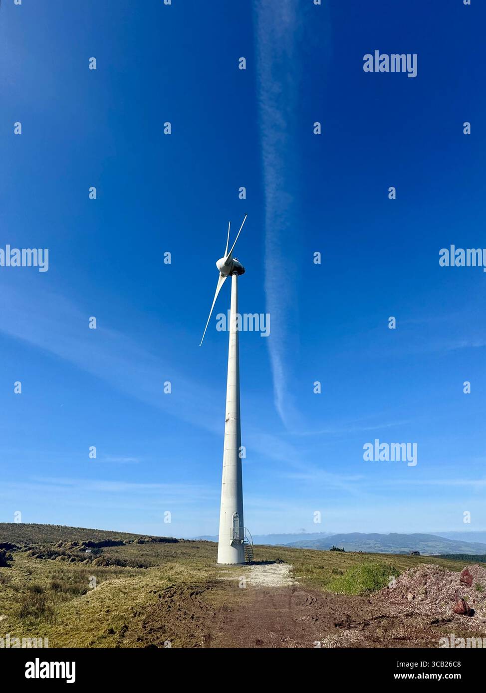 Wind turbines generating clean and renewable energy in the Azores, Portugal, under a clear blue sky. - Smartphone Captured Stock Image