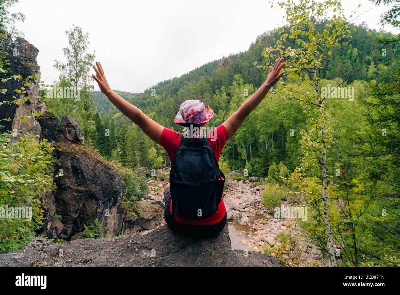 russia, zelenogorsk - 4 august 2025 Girl Raised Her Hands Up In Nature. High quality photo Stock Photo