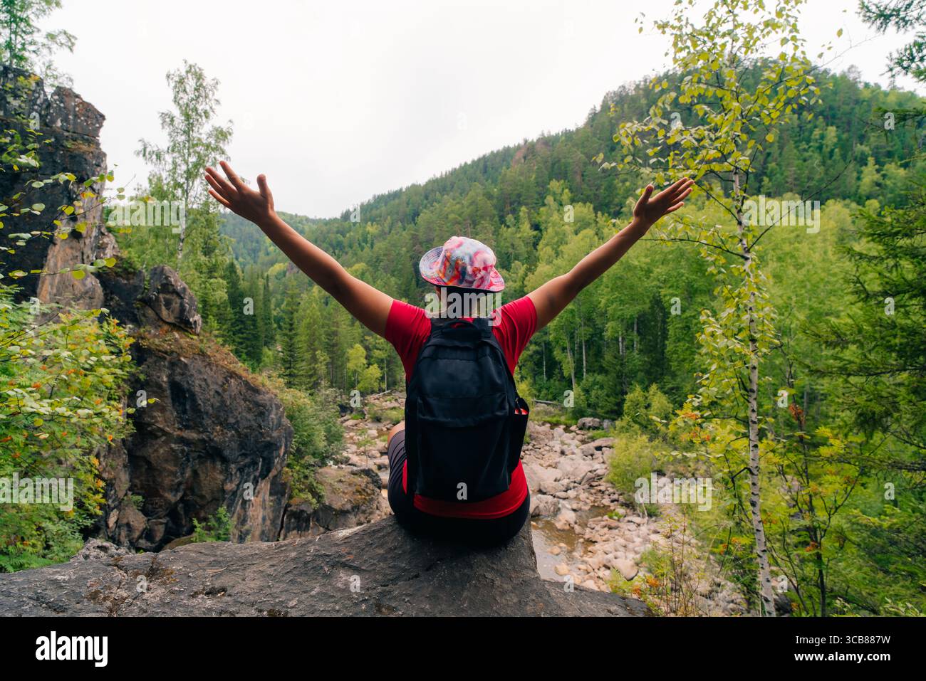 russia, zelenogorsk - 4 august 2025 Girl Raised Her Hands Up In Nature. High quality photo Stock Photo