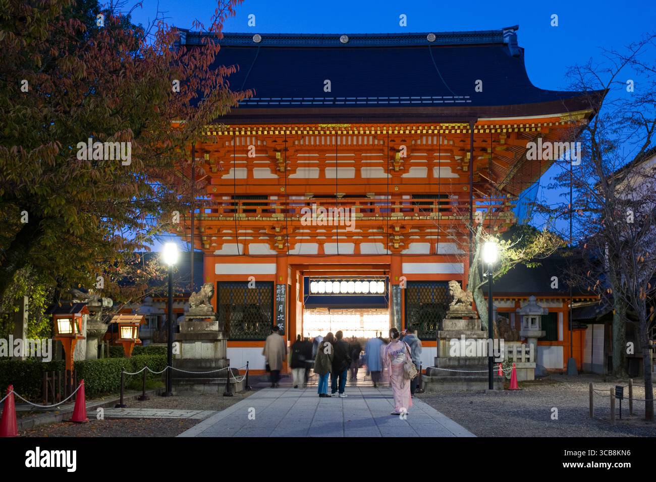 Illuminated South Tower Gate at Yasaka Shrine in the evening with ...