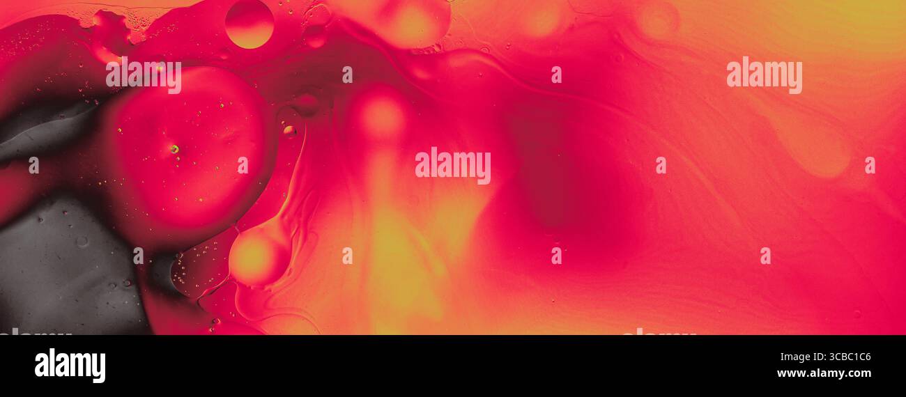 Abstract red and orange liquid texture with bubbles and black accent. Vivid and dynamic modern background in macro view. Stock Photo