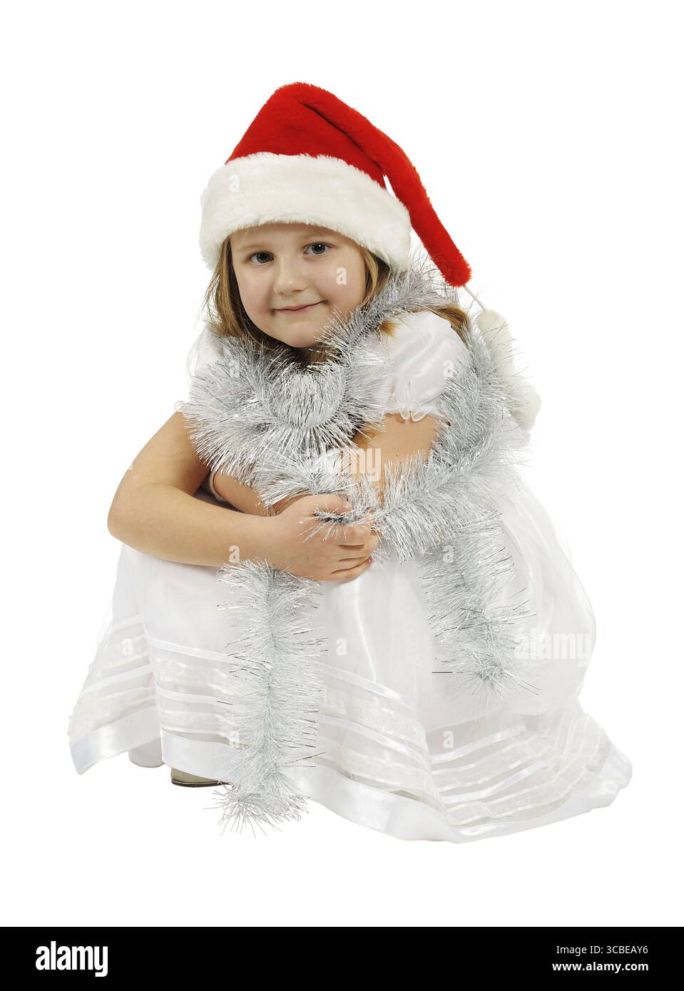 Girl with red hat, isolated on a white background Stock Photo