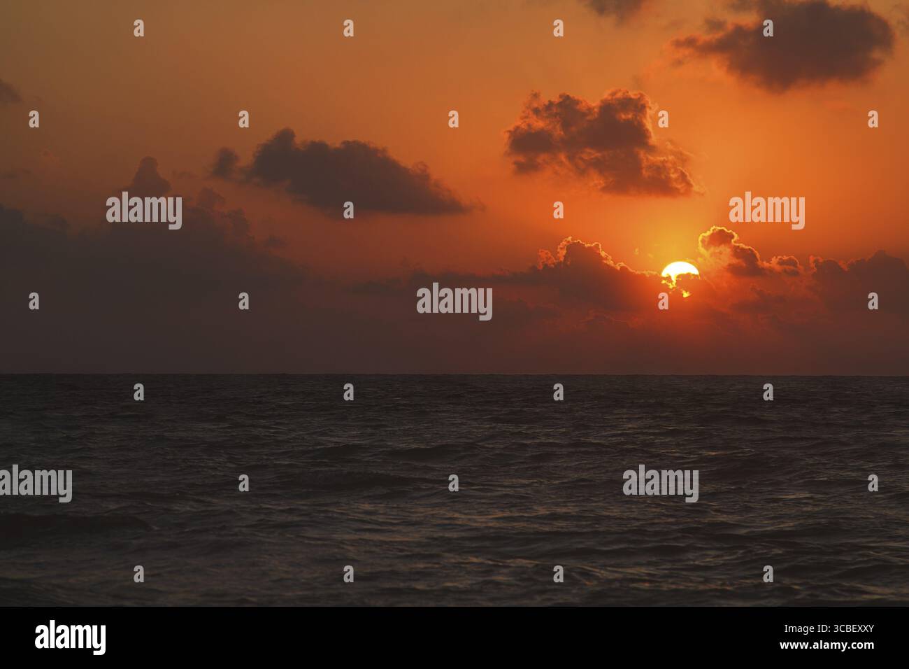Orange sunrise over the atlantic ocean Stock Photo - Alamy