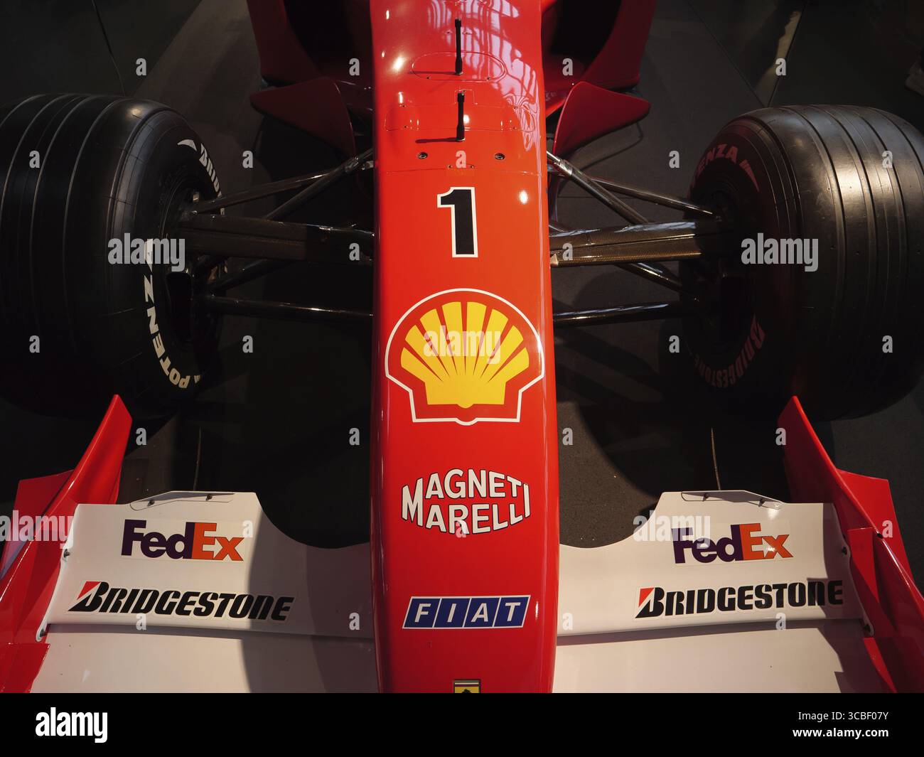 Front view of a red Formula 1 racing car with sponsor logos, Cologne ...