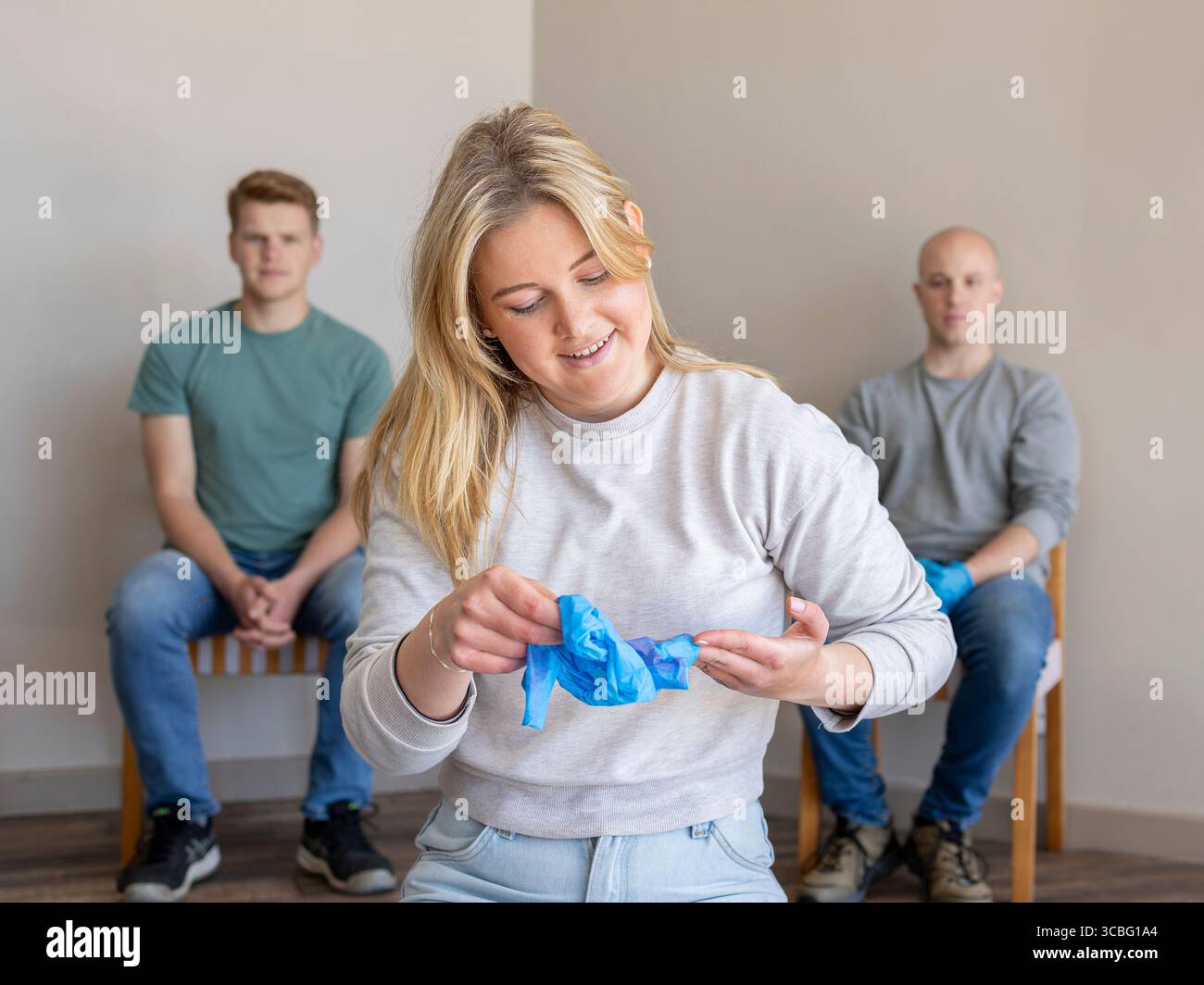 Taking off gloves, first aid training demonstration showing proper use ...