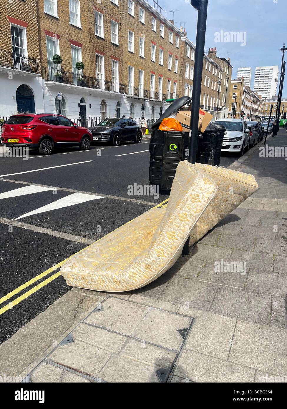 A discarded mattress, fly-tipped in Westminster, Central London W1 UK Stock Photo