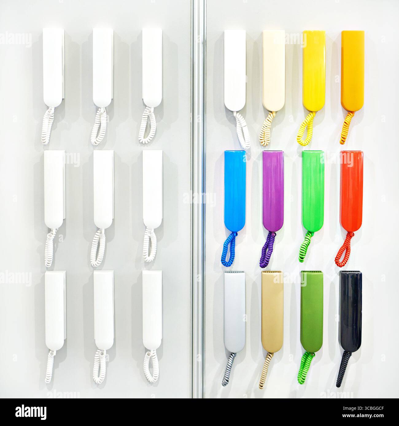 Colored handsets of intercom on display in a store Stock Photo