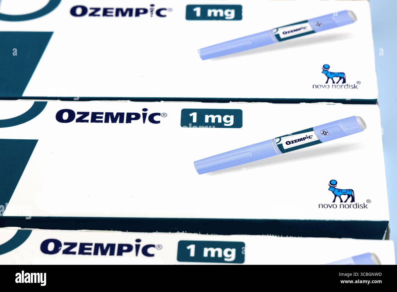 Ozempic semaglutide injection pen boxes by Novo Nordisk on blue background.  Copenhagen, Denmark - August 8, 2025 Stock Photo