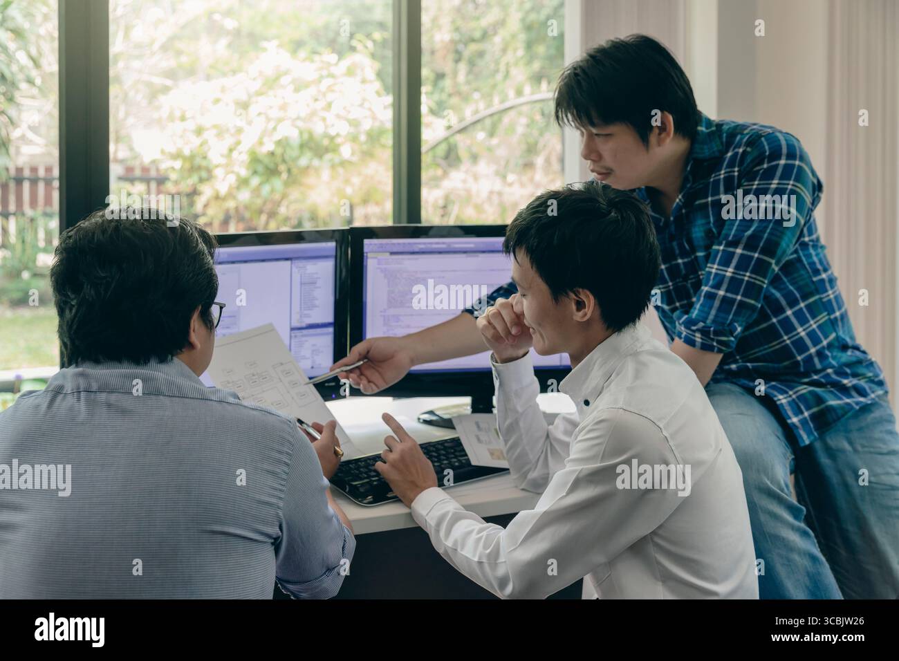 Programmers team working in a software developing. Developing programming and coding technologies. Website design. Cyber space concept. Stock Photo