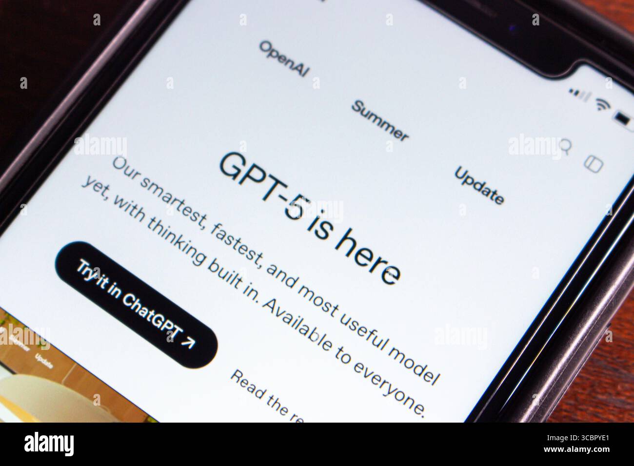Close-up of a smartphone displaying the GPT-5 release announcement on the OpenAI website, highlighting its advanced AI capabilities and availability. Stock Photo