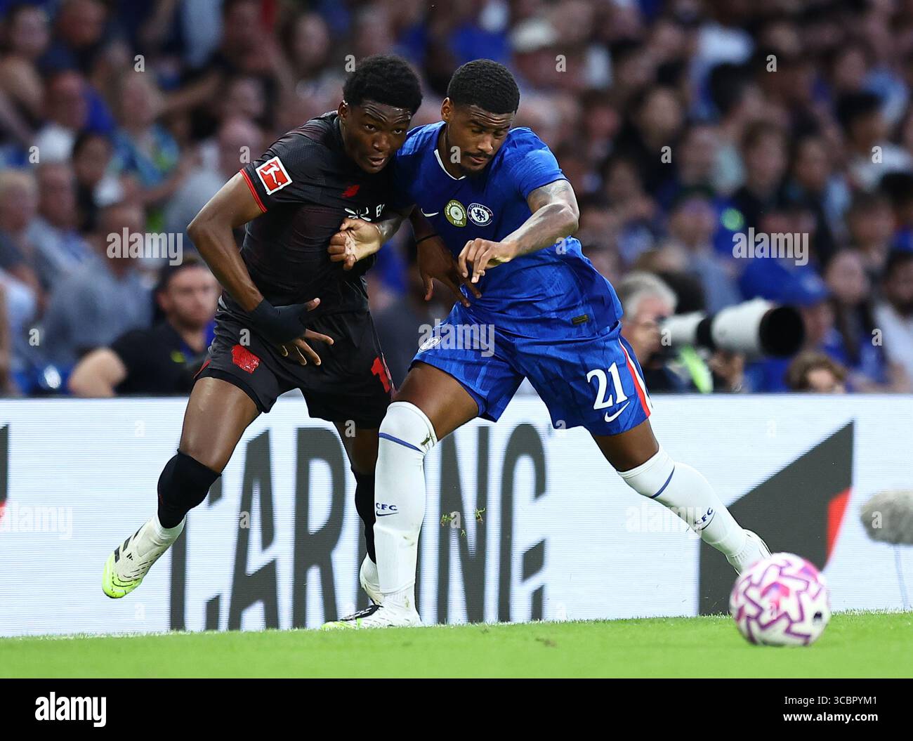 Jarrel Hato of Chelsea and Alejo Sarco of Bayern Leverkusen during ...