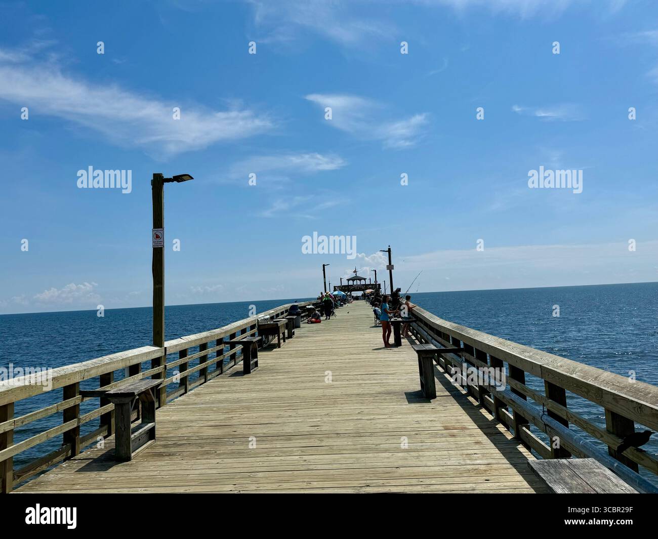 Cherry Grove Pier in North Myrtle reopened in 2024 after a reconstruction resulting in major damages from hurricane Ian in 2022. - Smartphone Captured Stock Image