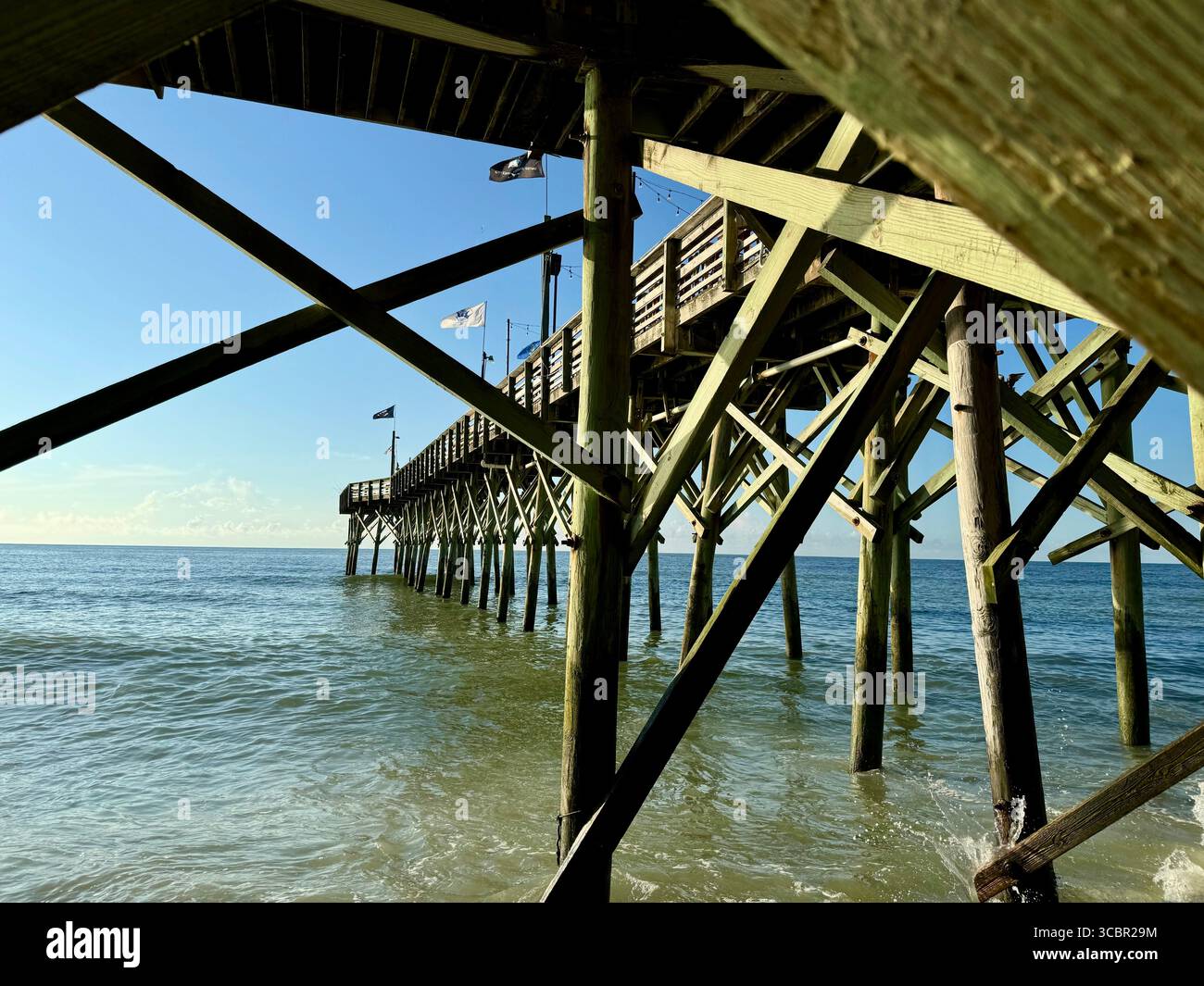 Sun bathing Pier 14 with an early morning glow. - Smartphone Captured Stock Image