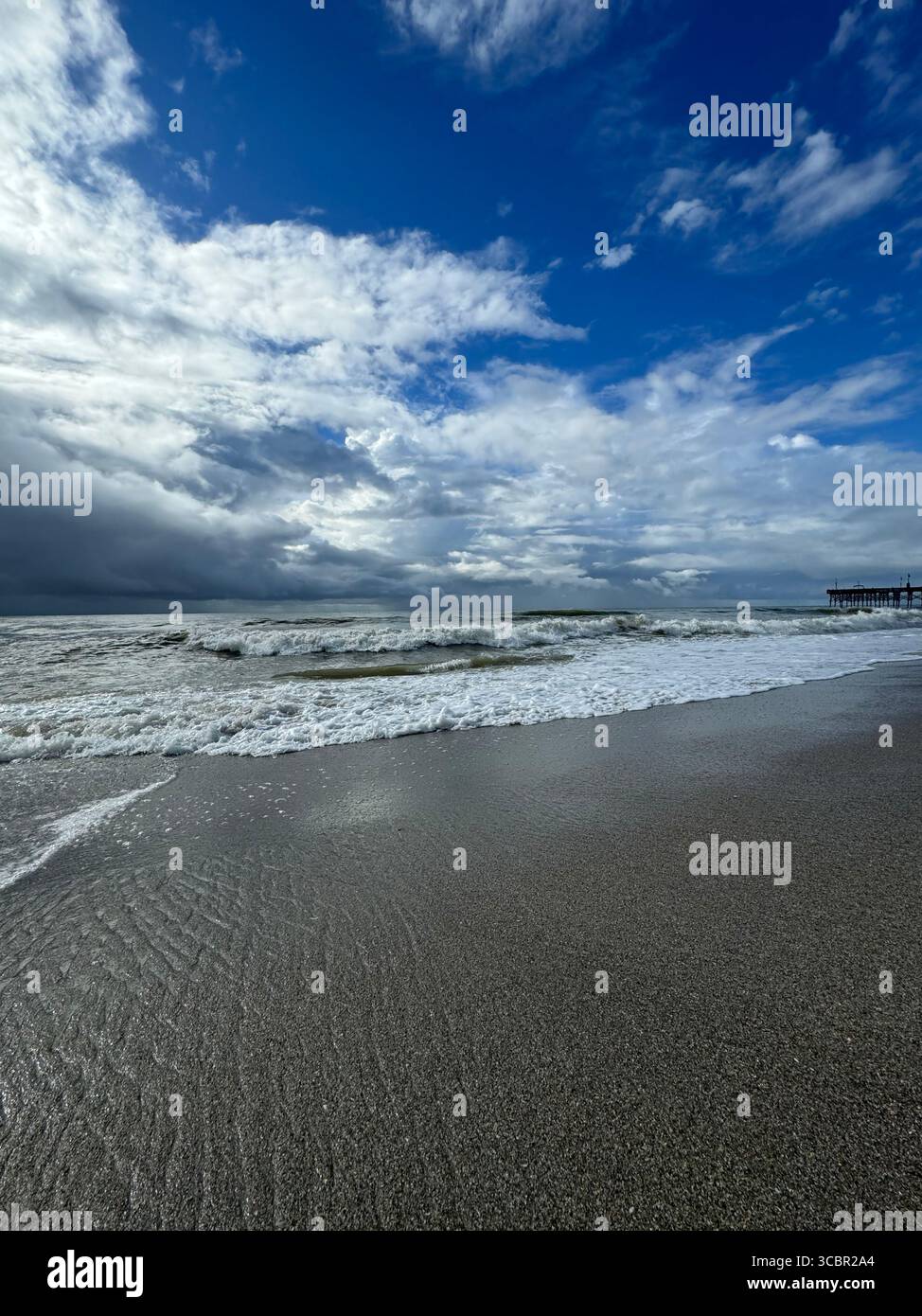 A rush of small waves with approaching at Myrtle Beach - Smartphone Captured Stock Image