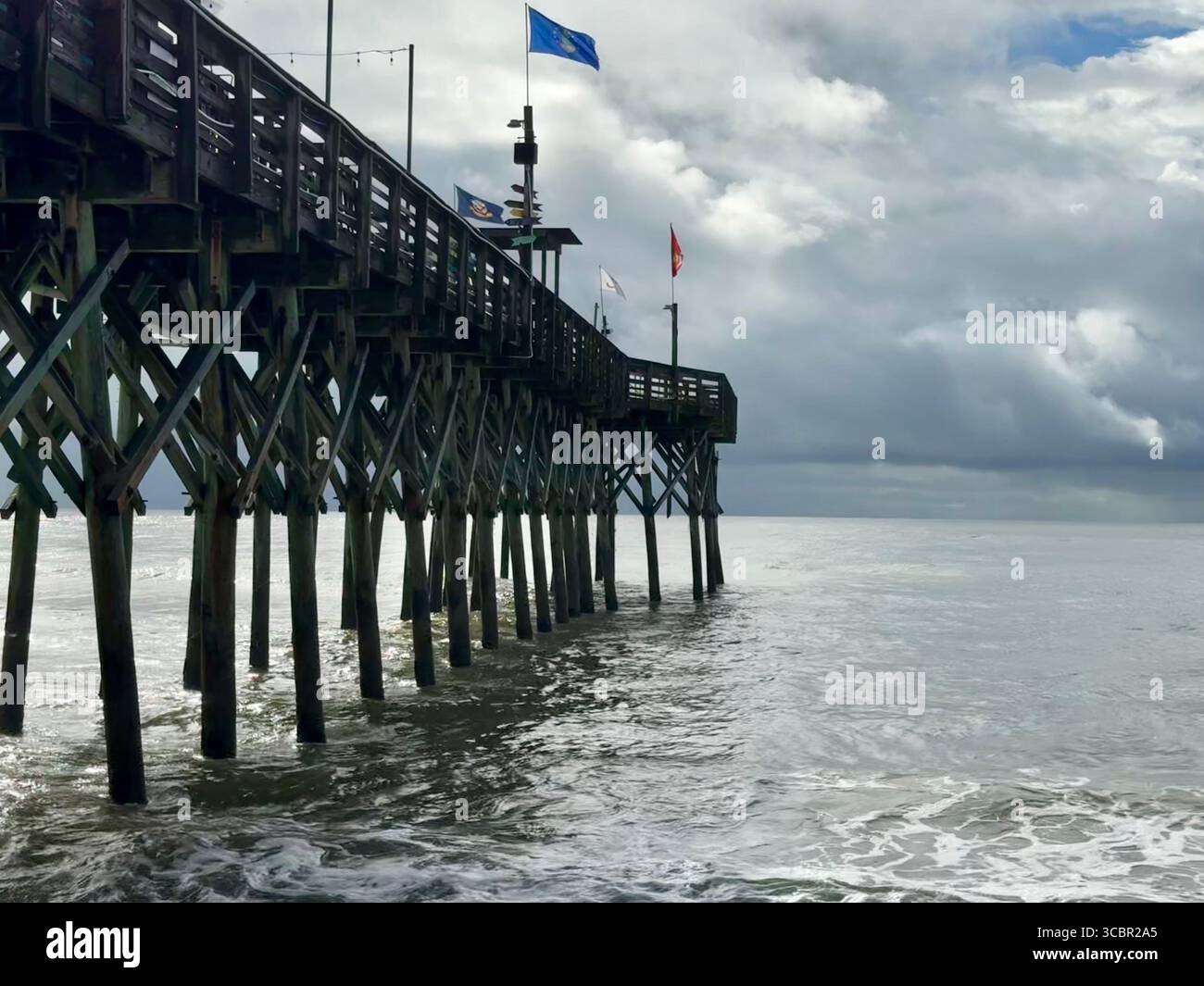 Pier 14, Myrtle Beach, with stormy weather moving in. - Smartphone Captured Stock Image