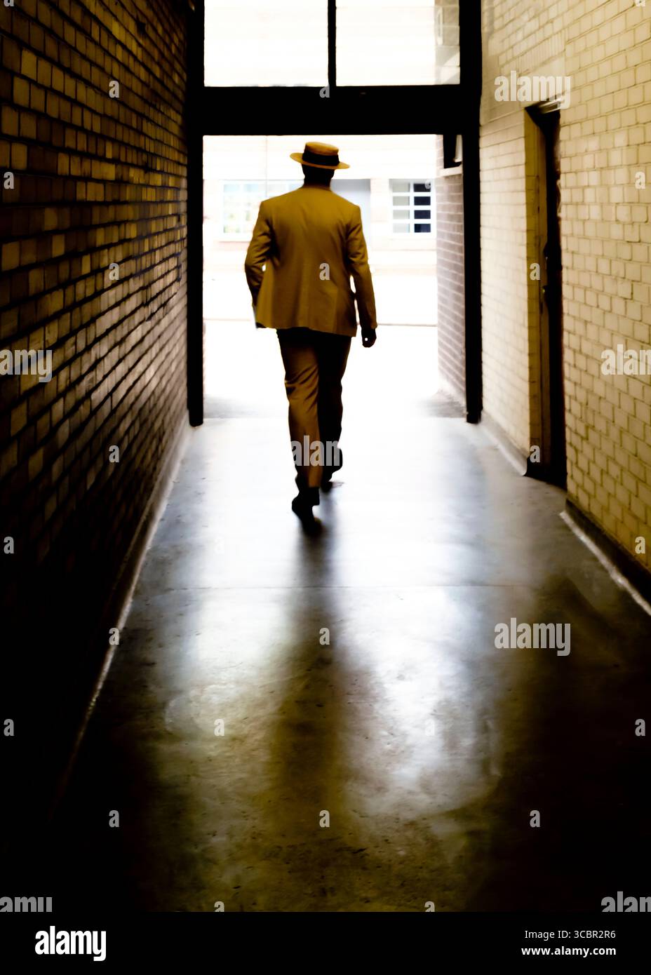 Man walks through hallway hi-res stock photography and images - Alamy