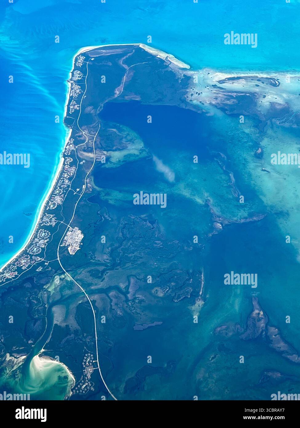 Aerial of beautiful blue Caribean water and Cayo Santa Maria, a resort island in Cuba. - Smartphone Captured Stock Image