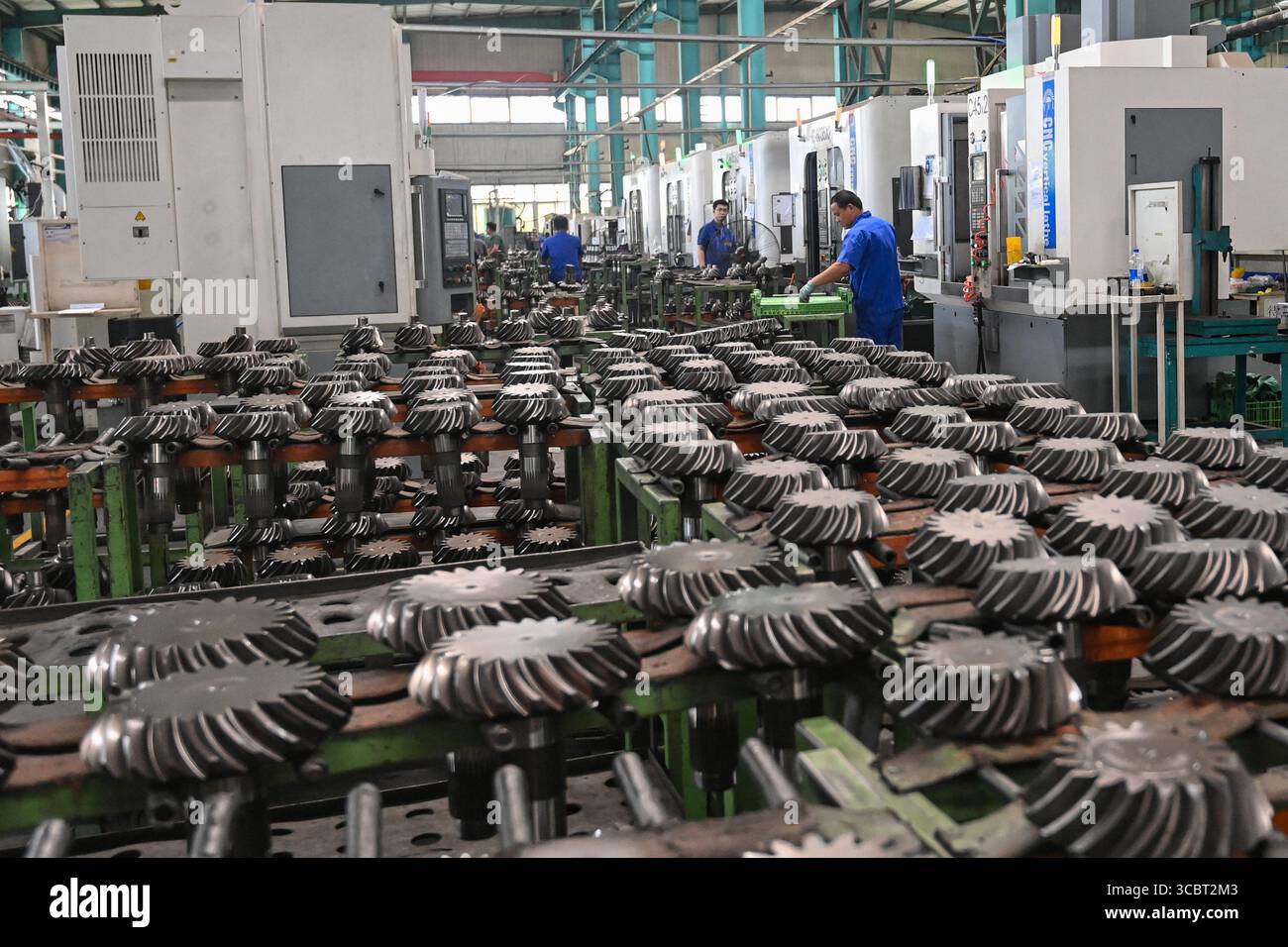 WEIFANG, CHINA - AUGUST 9, 2025 - A worker is working in a workshop of ...
