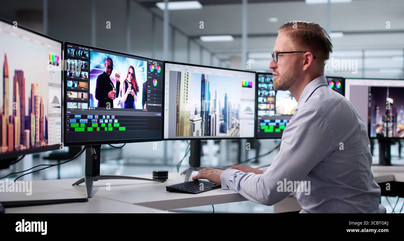 Young Caucasian Man Editing Graphic Video Using Advanced Desktop Software. Stock Photo