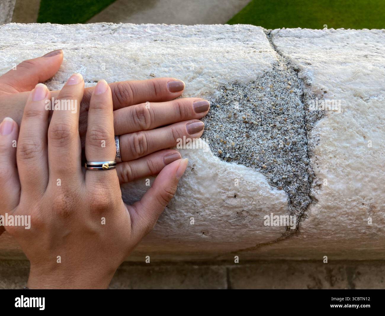 Close up on hands together in wornout balcony - Smartphone Captured Stock Image