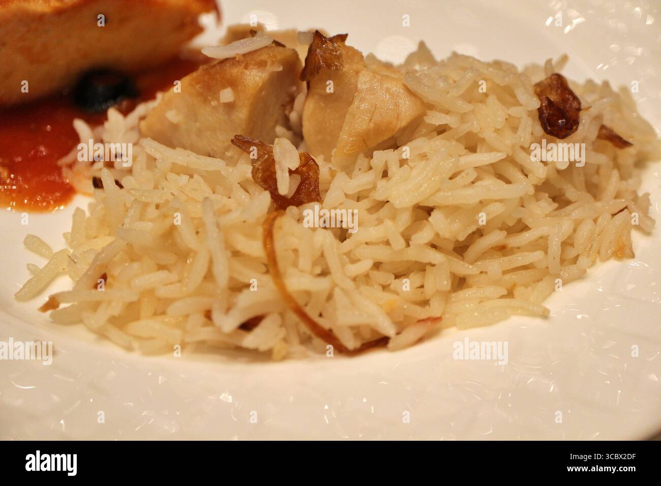Iranian cuisine: chicken pilaf rice in Doha, Qatar Stock Photo