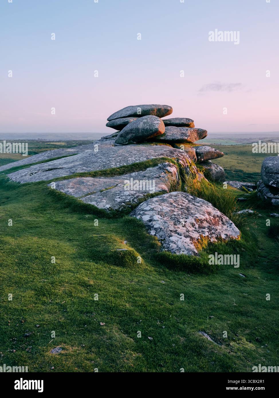 Exposed granite rock formation at dusk on Stowes Hill tor, Minions, Bodmin Moor, Cornwall England UK Stock Photo