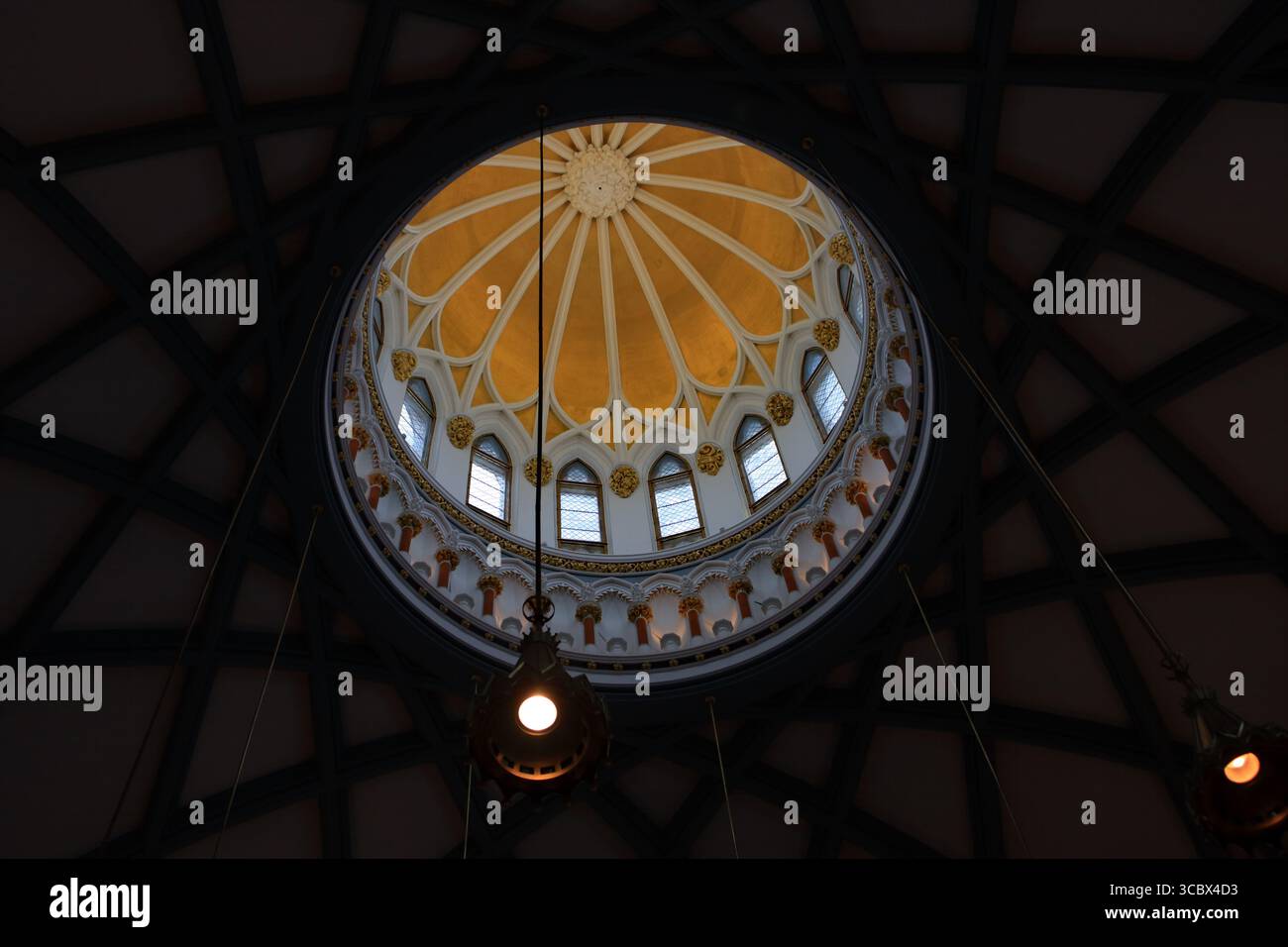 Ottawa, Ontario, Canada - February 22, 2009: Ornate ceiling cupola of the National Parliamentary Library featuring Gothic Revival architecture and sky Stock Photo