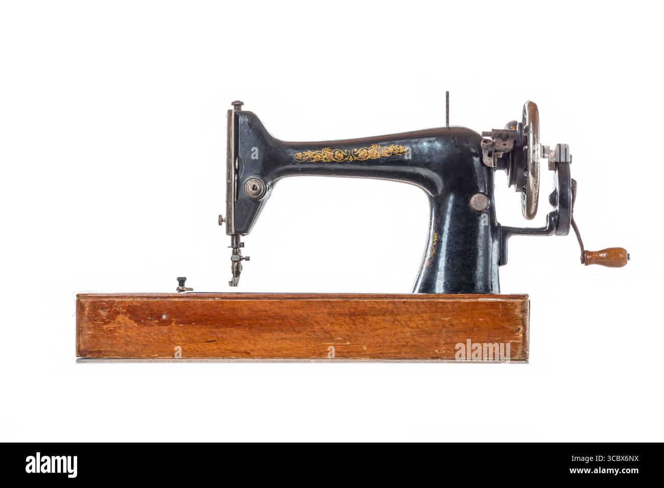 Old vintage sewing machine isolated on white background. Stock Photo