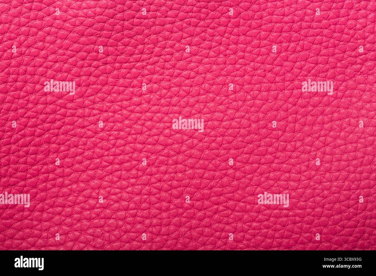 Pink red textured leather background. Abstract leather texture. Stock Photo