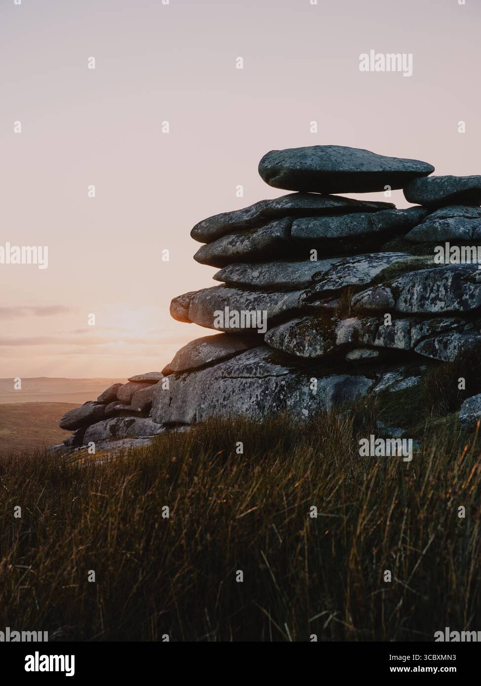 Sunset over the granite tor on Stowes Hill, Minions, Bodmin Moor, Cornwall England UK Stock Photo