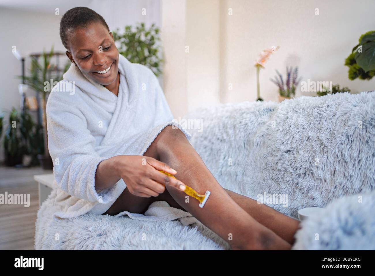 Woman shaving leg home hi-res stock photography and images - Alamy