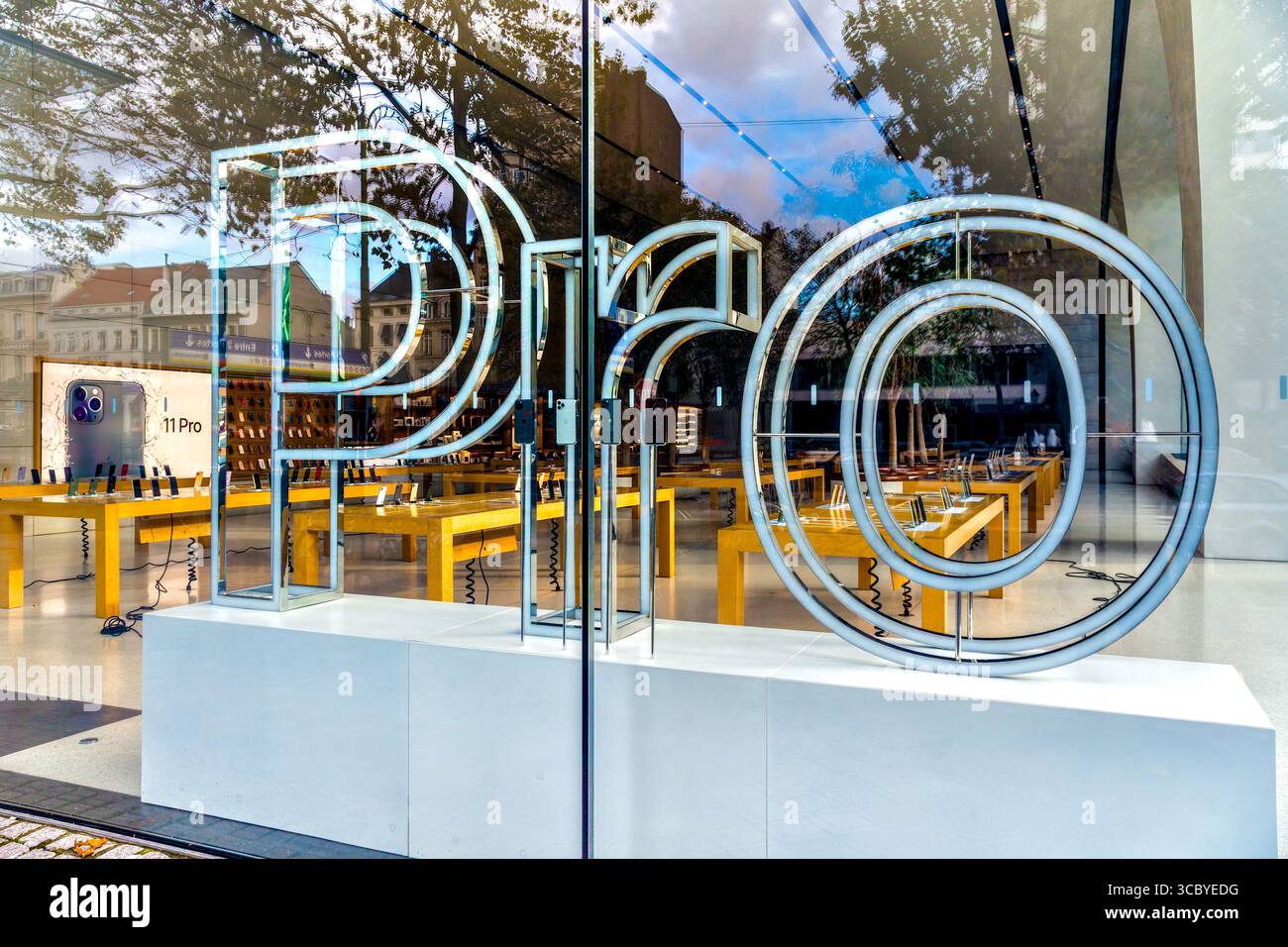 Modern "Pro" sculpural logo for iPhone display in window of Apple store -Bbrussels, Belgium. Stock Photo
