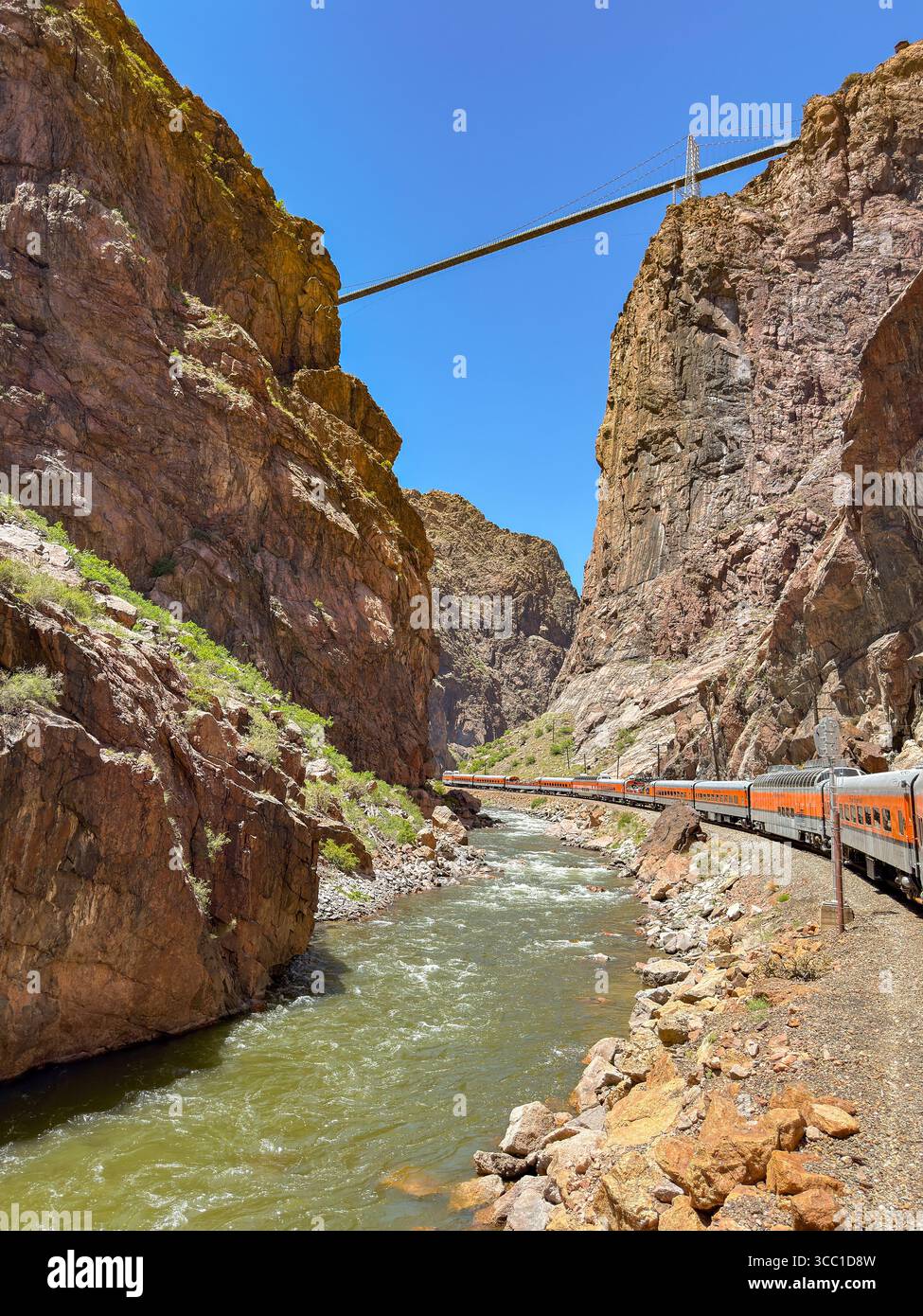 Canon City, Colorado, USA - 22 May 2025: Scenic view of a train on Royal Gorge Route Railroad alongside the Arkansas River and the Royal Gorge Bridge - Smartphone Captured Stock Image