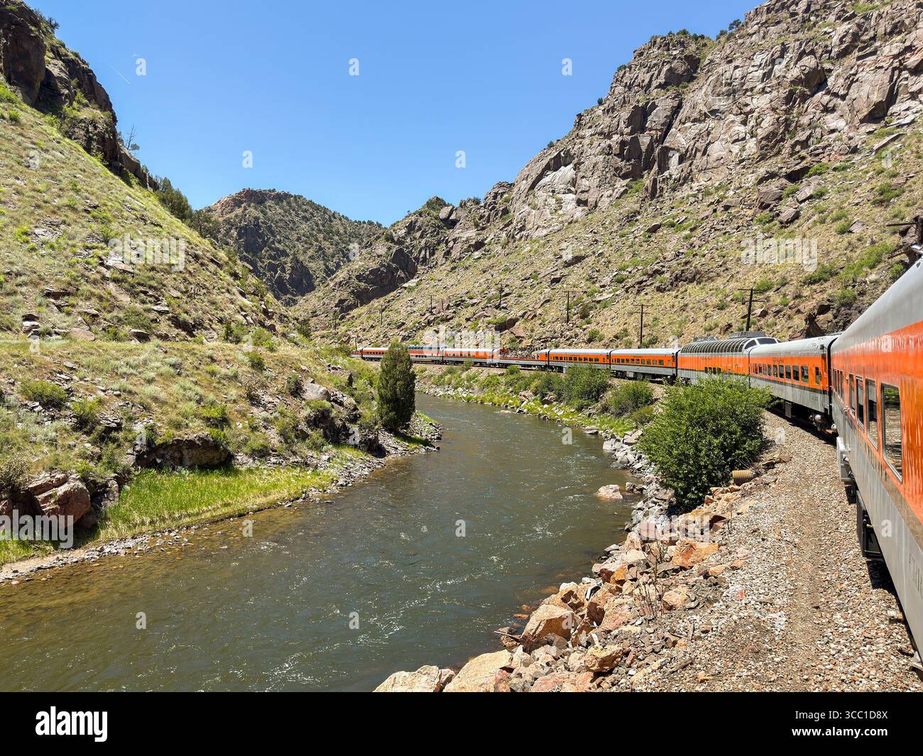 Canon City, Colorado, USA - 22 May 2025: Scenic landscape view of a train on Royal Gorge Route Railroad running alongside the Arkansas River - Smartphone Captured Stock Image