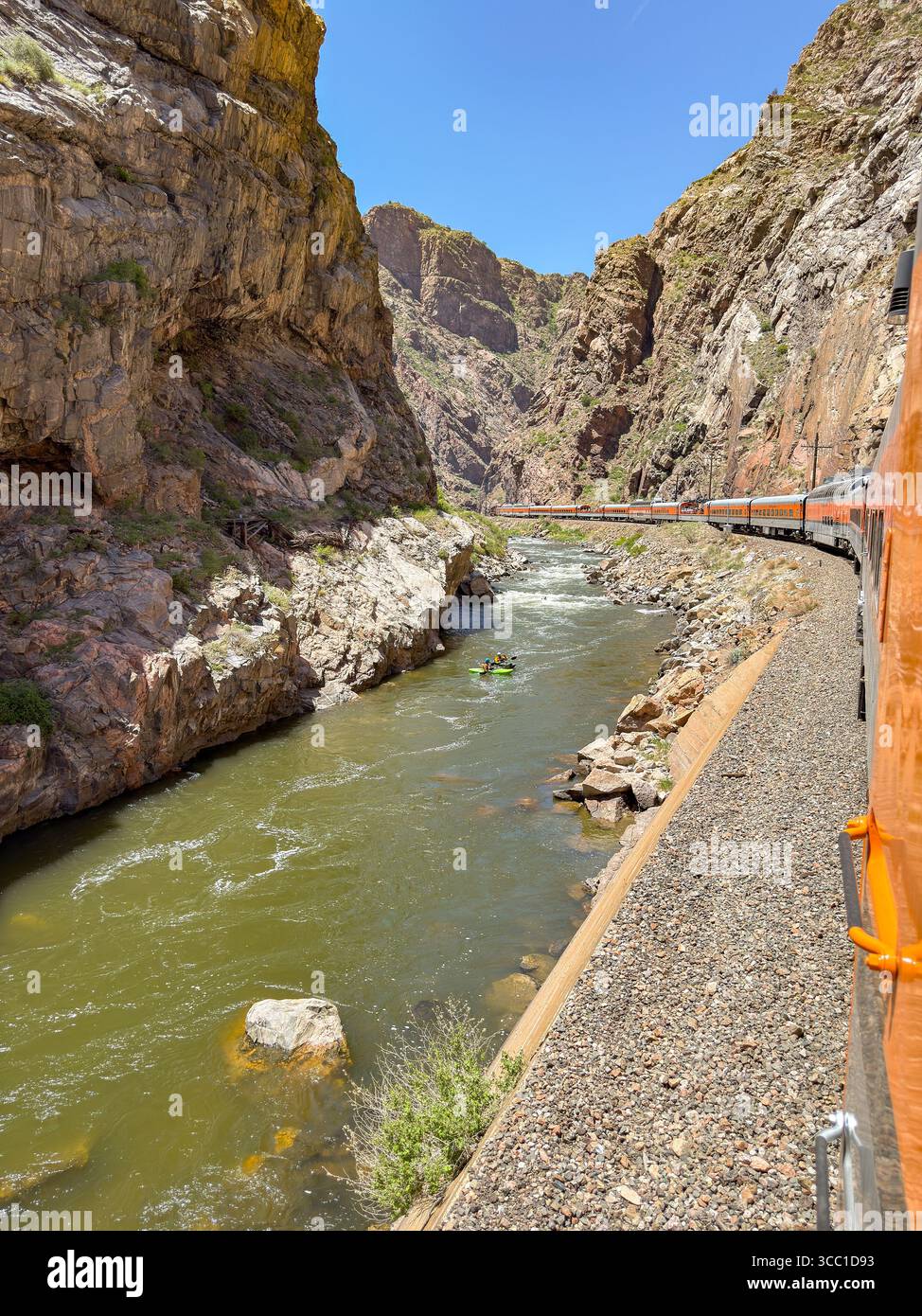 Canon City, Colorado, USA - 22 May 2025: Scenic landscape view of a train on Royal Gorge Route Railroad running alongside the Arkansas River - Smartphone Captured Stock Image