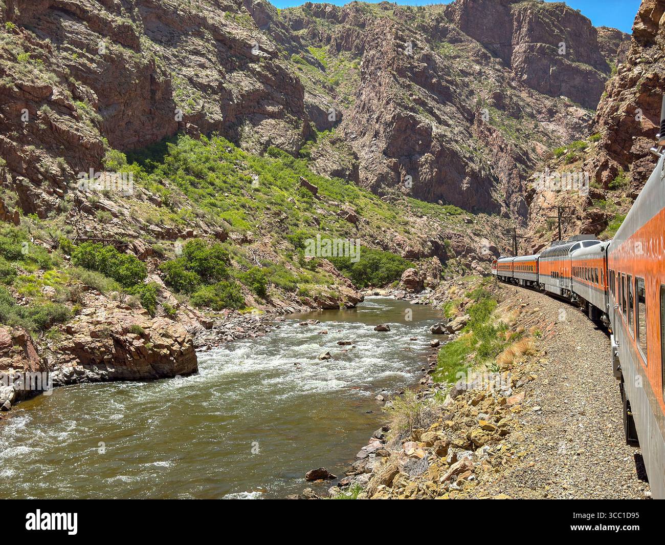 Canon City, Colorado, USA - 22 May 2025: Scenic landscape view of a train on Royal Gorge Route Railroad running alongside the Arkansas River - Smartphone Captured Stock Image