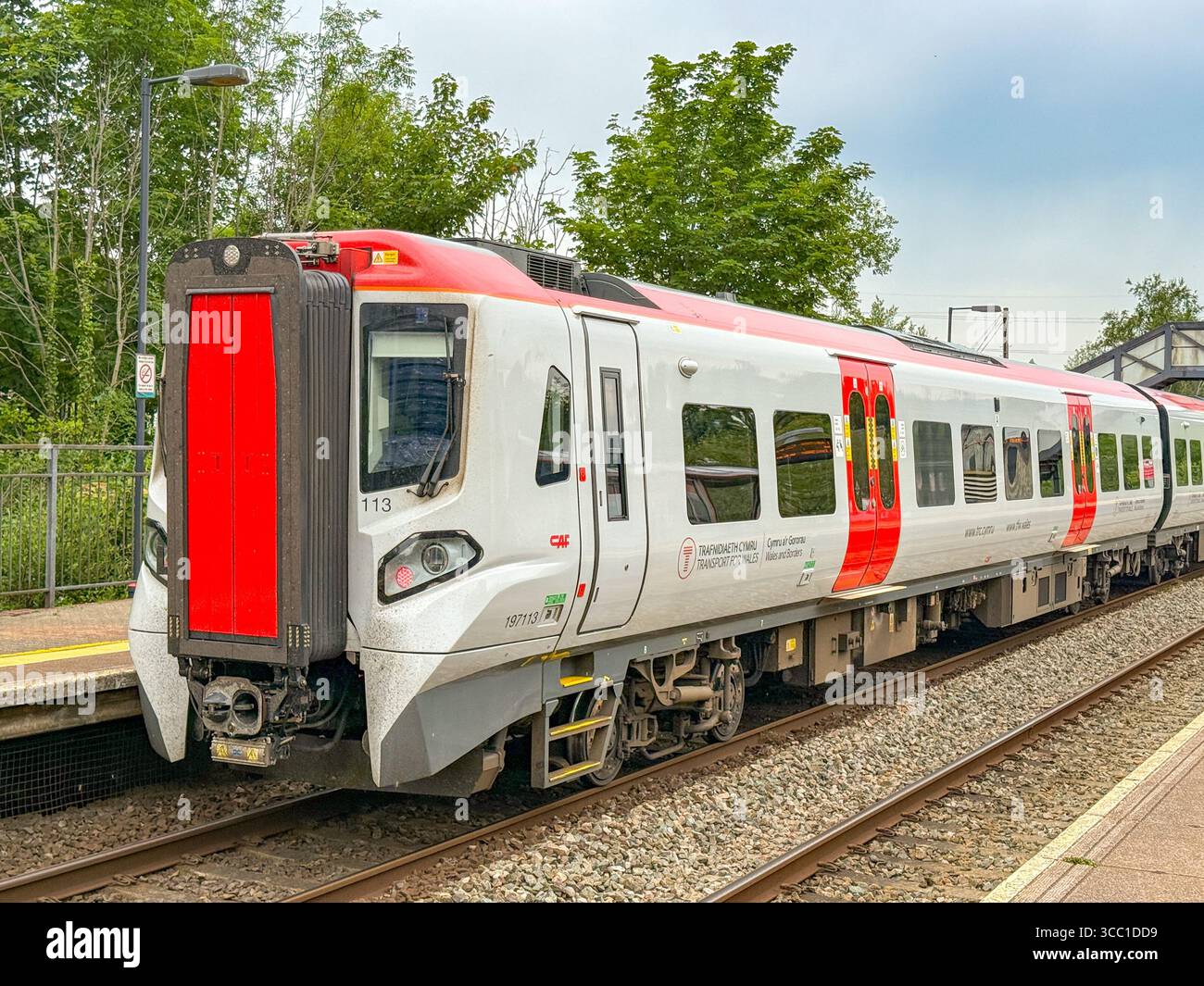 Pontyclun, Wales, UK - 20 June 2025: Transport for Wales Class 197 commuter train stopped at the railway station in the village of Pontyclun - Smartphone Captured Stock Image